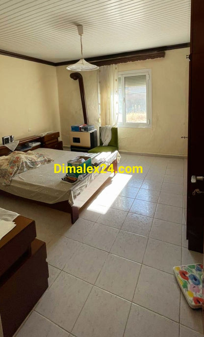 Просторна спалня с голямо легло и алуминиева дограма и ролетни щори  - имот в Северна Гърция.