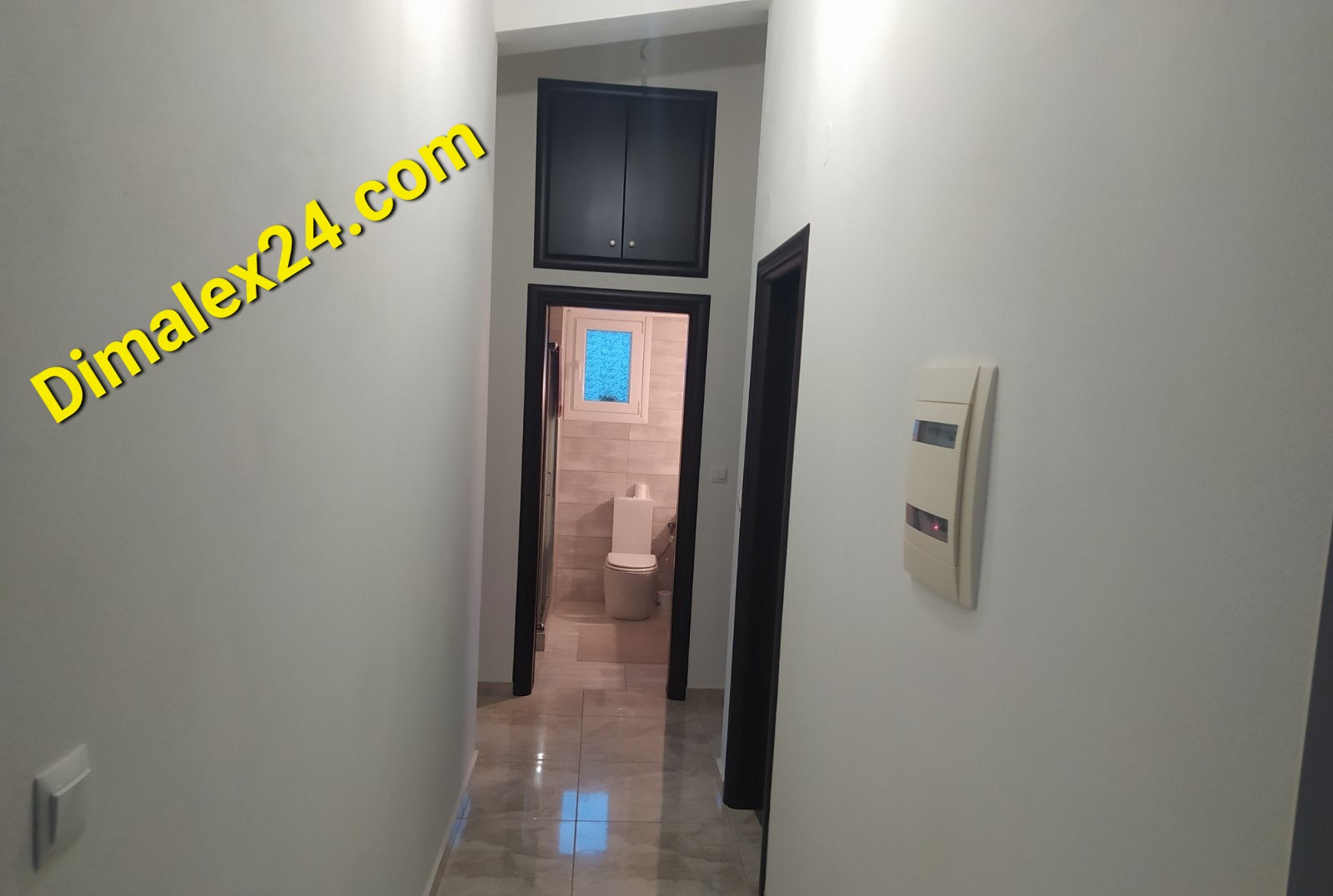 Interior hallway view of a multi-family house in Northern Greece with modern design and natural light.