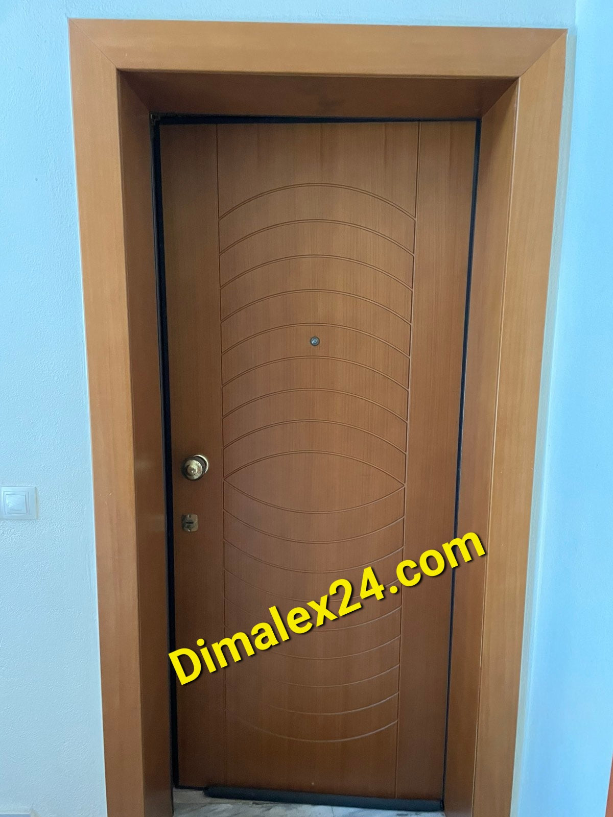 Modern wooden entrance door with a unique design, ideal for enhancing home aesthetics and security.